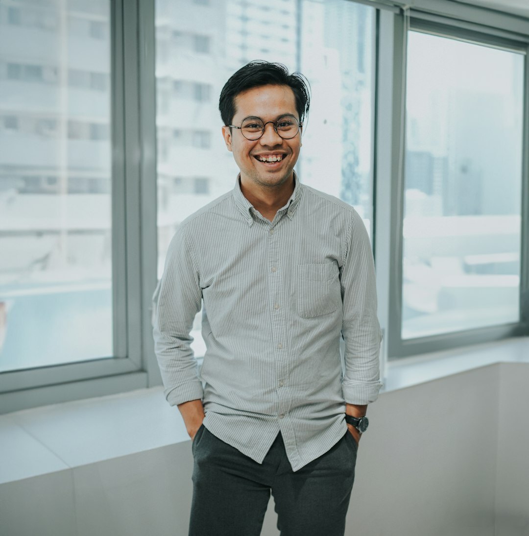 Young European tech analyst man with light stubble and casual look