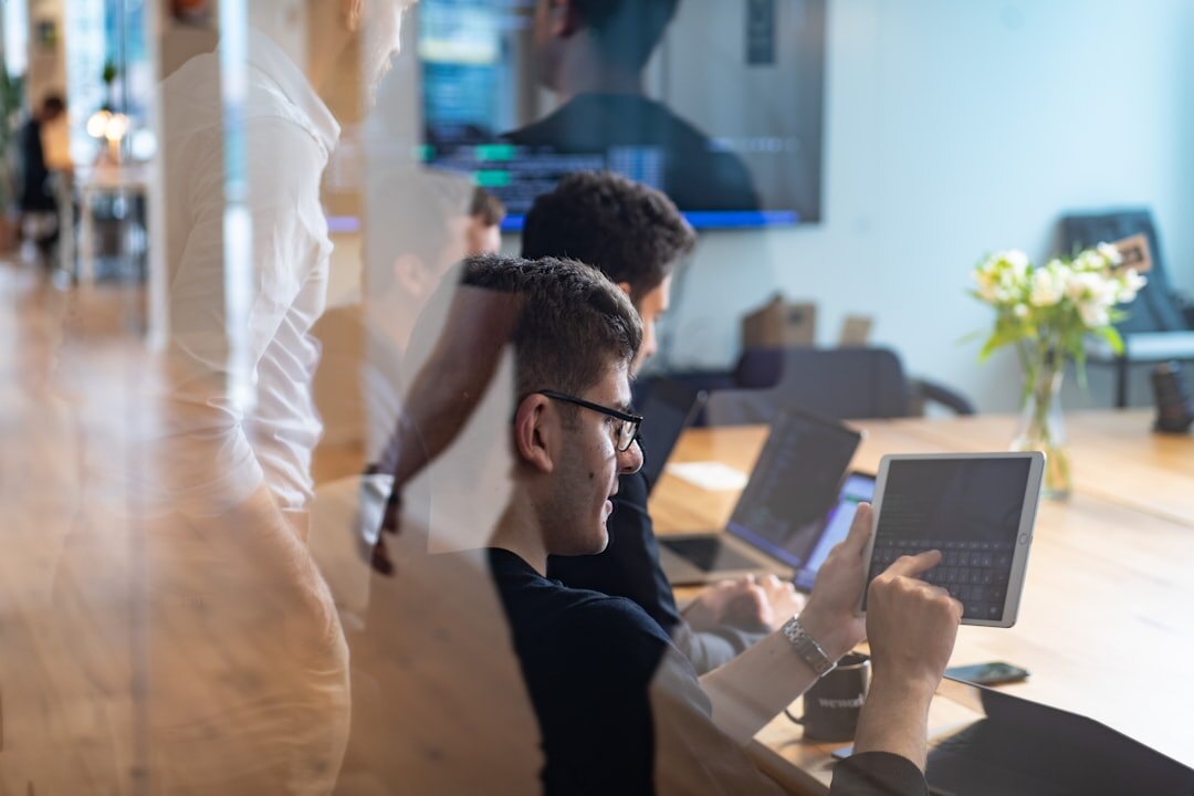 Diverse startup team working together in a modern bright office with laptops