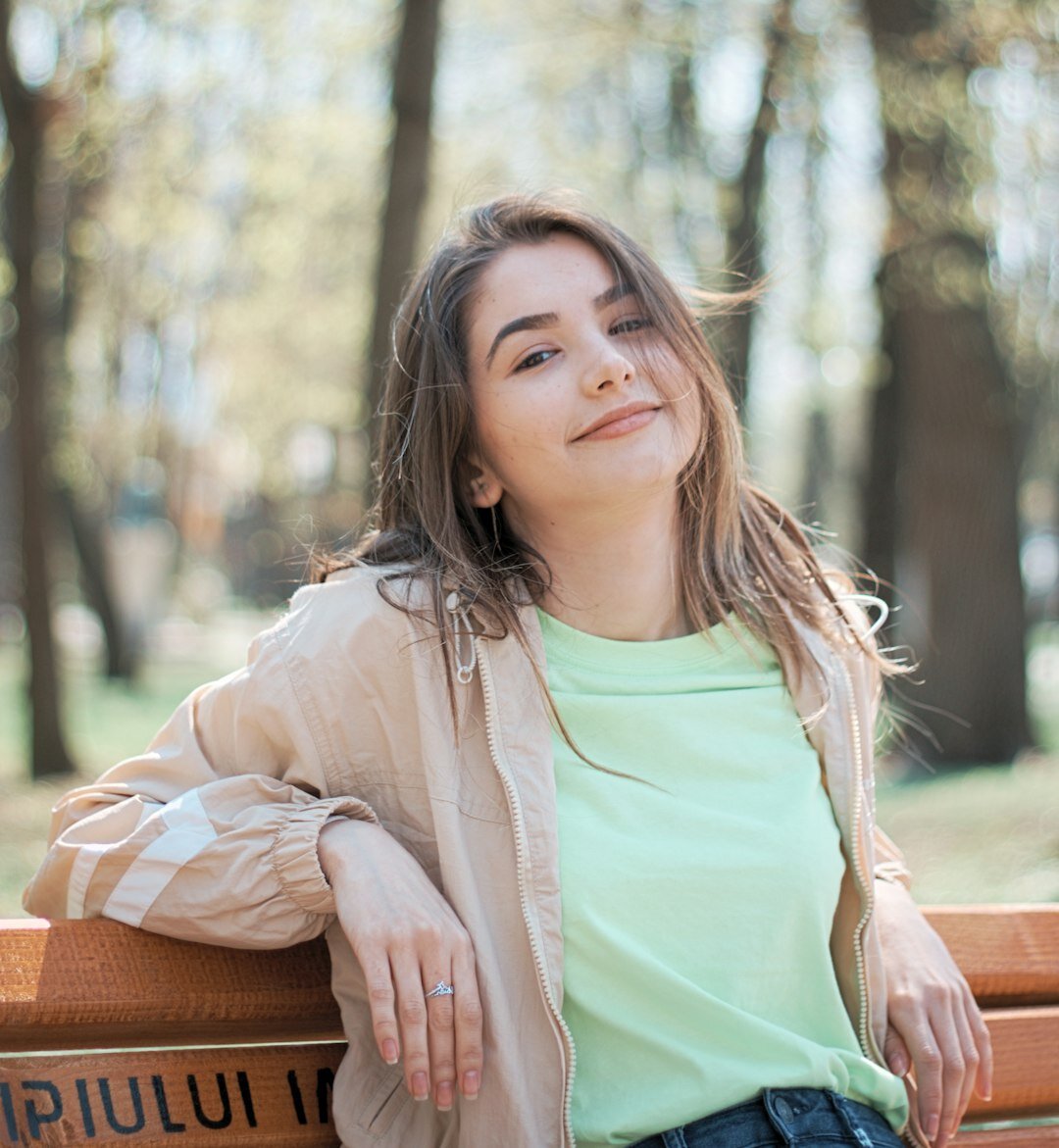 Young professional woman with blonde hair and warm smile in smart casual outfit